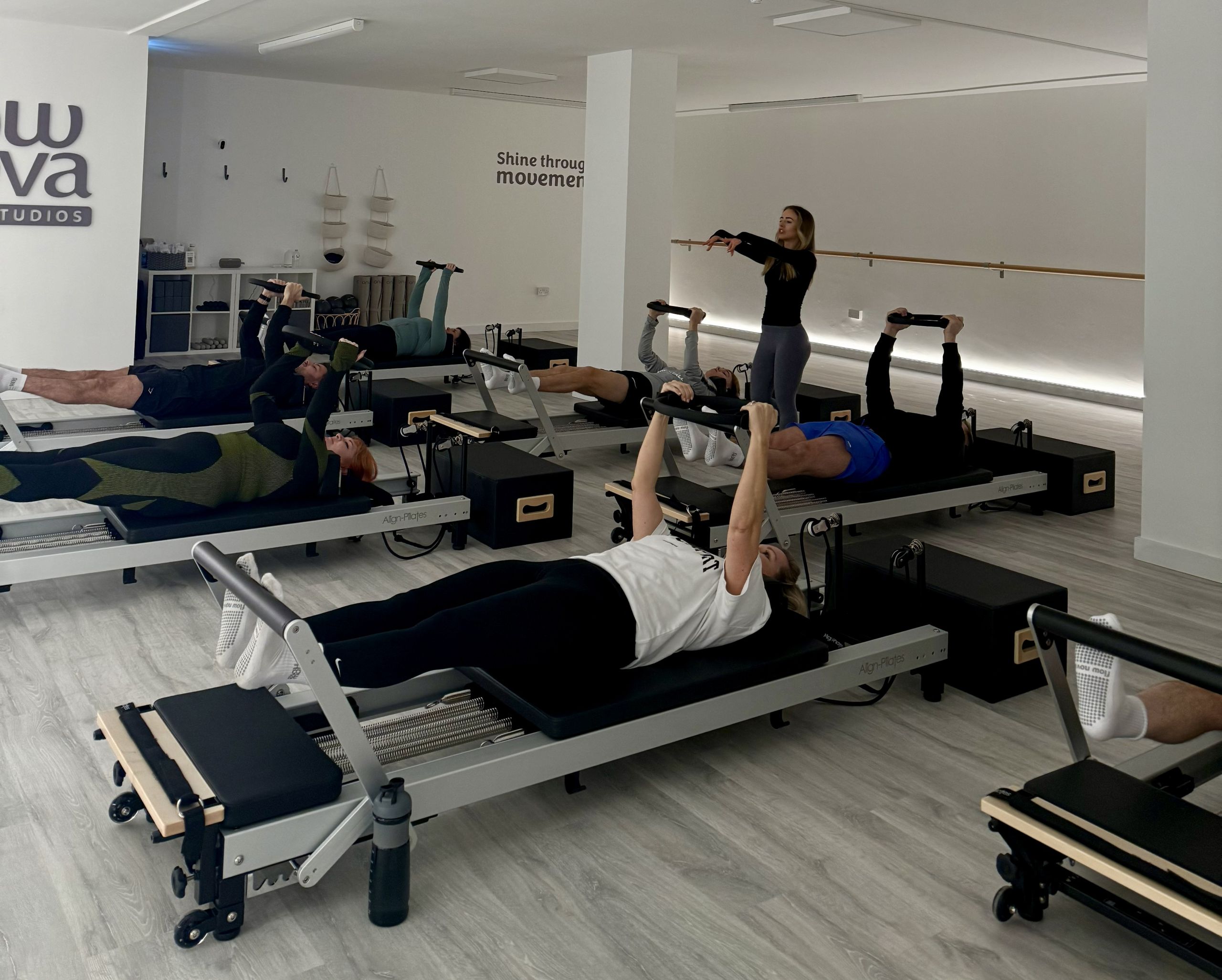 Instructor Teaching Reformer Pilates in Warrington